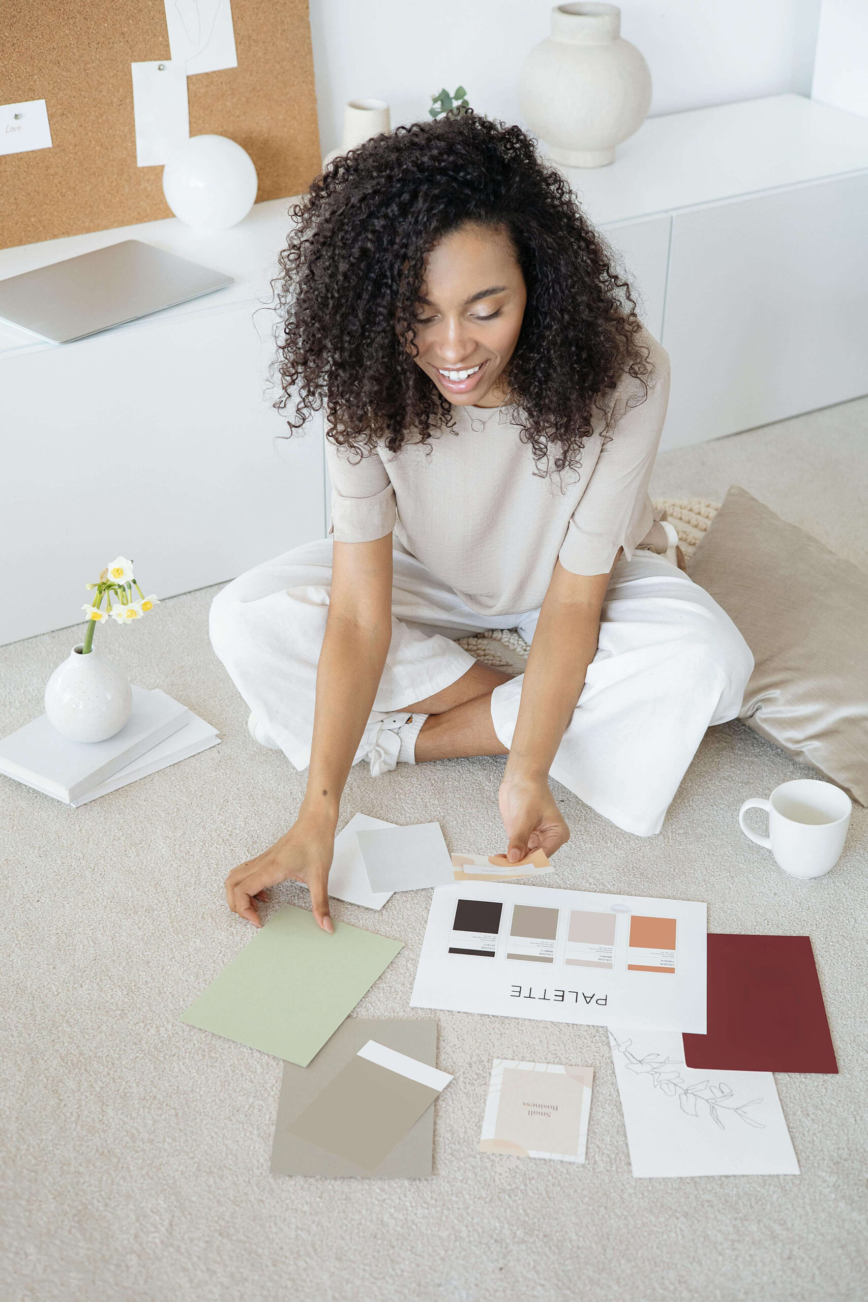 woman looking at different color palettes for her brand